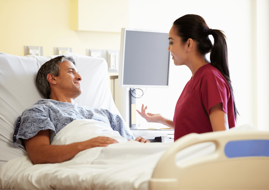 Patient being repositioned in bed to prevent pressure sores after spinal cord injury 